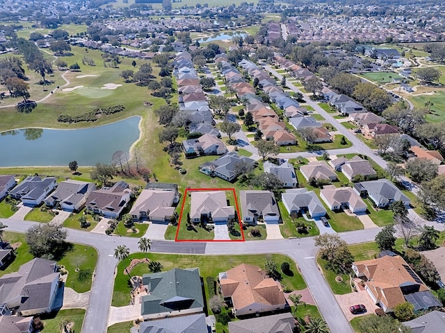 drone / aerial view with a water view and a residential view