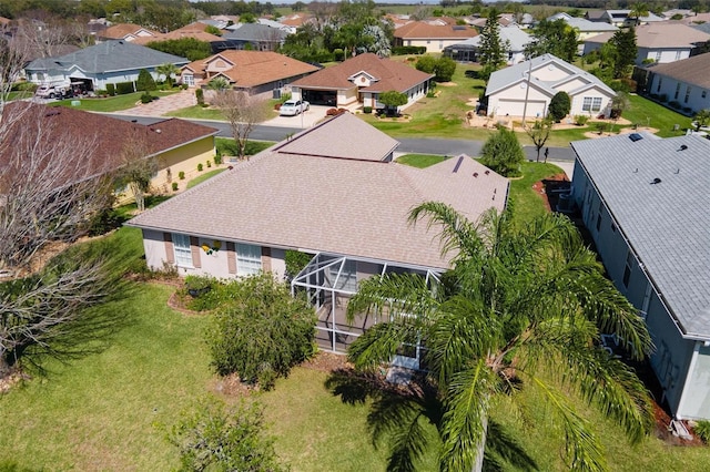 birds eye view of property with a residential view