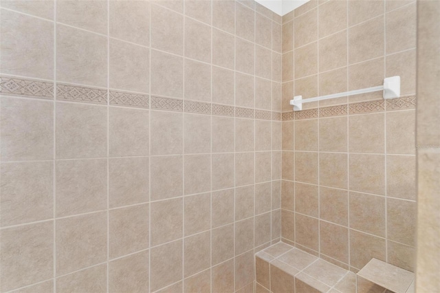 full bath with tiled shower