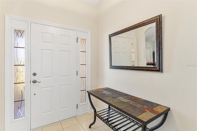 foyer with light tile patterned flooring