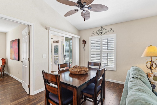 dining area with ceiling fan, baseboards, vaulted ceiling, and dark wood-style flooring