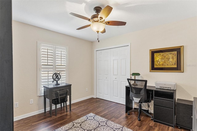 office space featuring dark wood-style floors, a ceiling fan, and baseboards