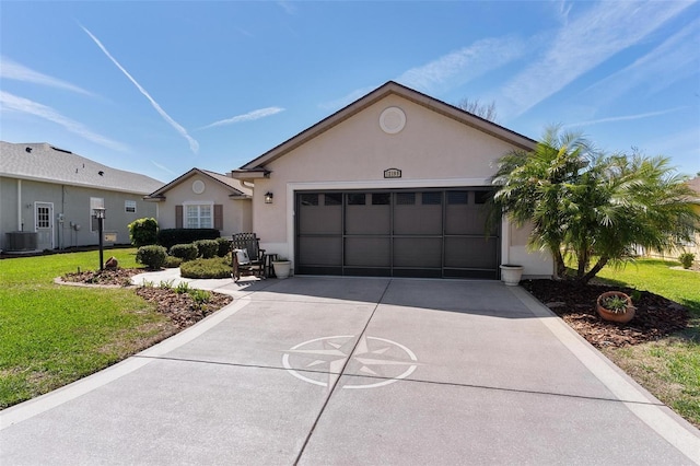 single story home featuring concrete driveway, an attached garage, a front lawn, central AC, and stucco siding