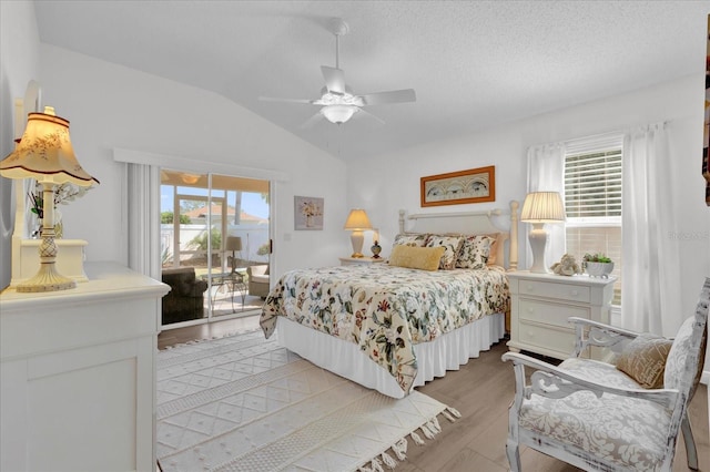1923 Greeleyville Ter, The Villages, FL 32162 - bedroom with lofted ceiling, light wood-style floors, access to outside, and multiple windows