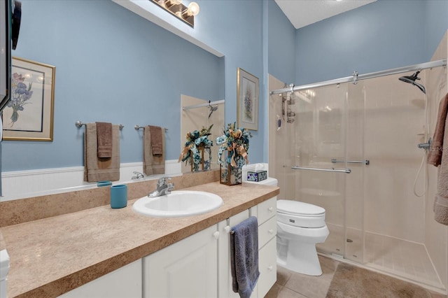 1923 Greeleyville Ter, The Villages, FL 32162 - bathroom with vanity, a shower stall, toilet, and tile patterned floors