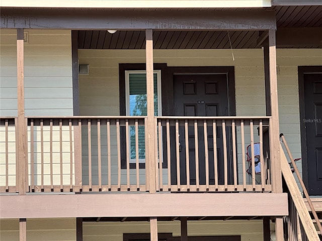 view of exterior entry with a porch