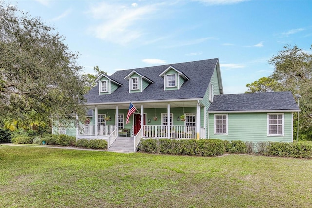 cape cod-style house featuring a porch, a front yard, and roof with shingles