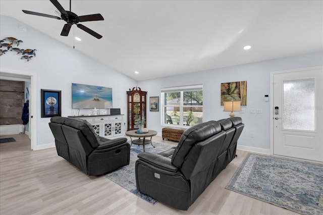 living room with light wood-style floors, recessed lighting, and vaulted ceiling