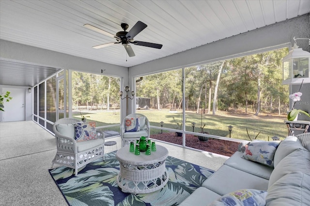 sunroom featuring a ceiling fan