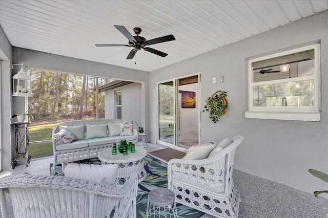 sunroom / solarium featuring wood ceiling and ceiling fan