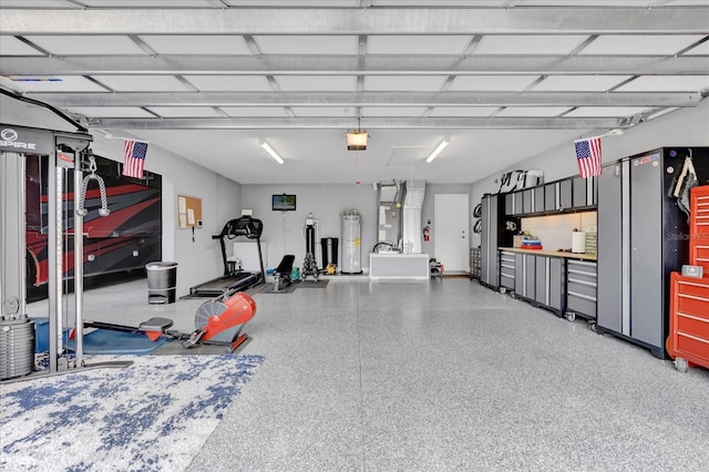 garage with a garage door opener and water heater