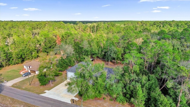 birds eye view of property with a wooded view