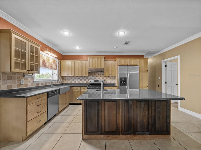 kitchen featuring stainless steel appliances, a sink, under cabinet range hood, and light tile patterned floors