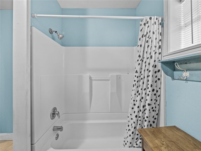 full bath featuring shower / bath combo with shower curtain