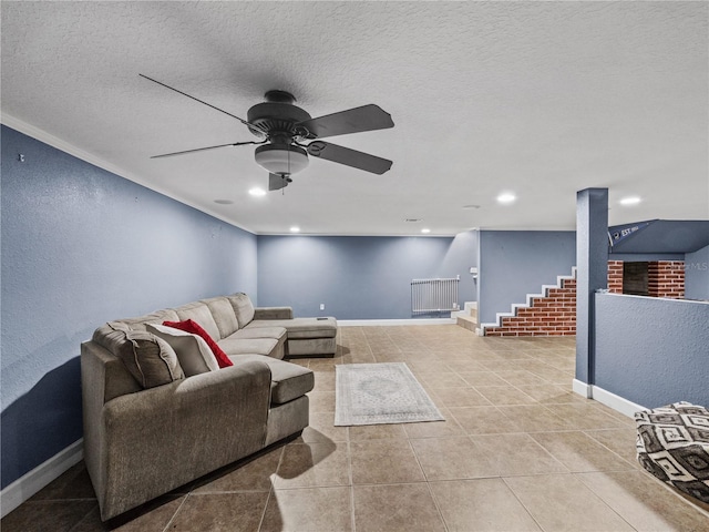 living room featuring baseboards, stairway, a textured ceiling, and tile patterned floors