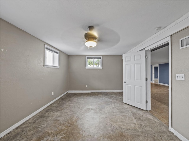 unfurnished bedroom featuring ceiling fan, visible vents, and baseboards