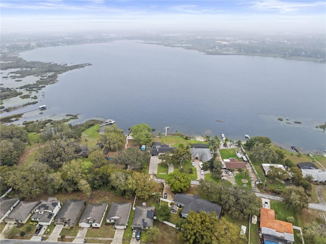 birds eye view of property featuring a water view and a residential view