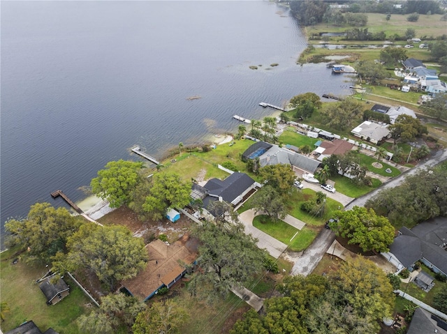 drone / aerial view with a water view and a residential view