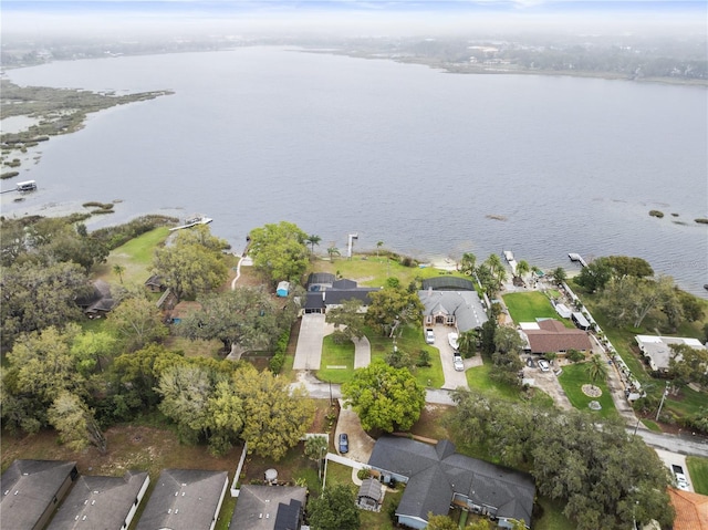 bird's eye view featuring a residential view and a water view