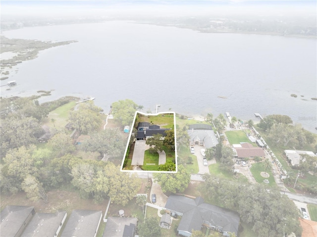 birds eye view of property featuring a water view and a residential view