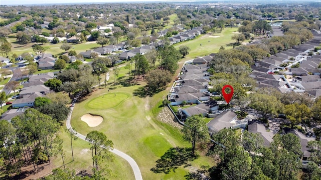 birds eye view of property with golf course view and a residential view