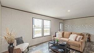 living room featuring crown molding