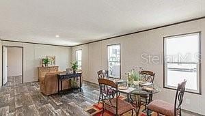 dining room featuring crown molding and wood finished floors