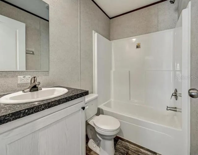 full bathroom featuring shower / tub combination, vanity, and toilet