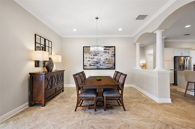 dining room featuring arched walkways, ornate columns, visible vents, ornamental molding, and baseboards