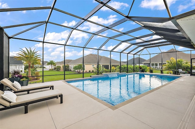 pool with a yard, a patio area, a lanai, and a residential view