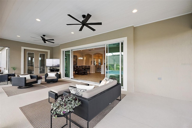 view of patio / terrace featuring french doors, ceiling fan, and an outdoor hangout area