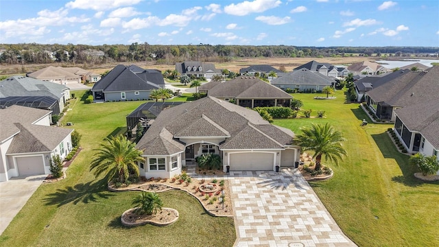 birds eye view of property with a residential view