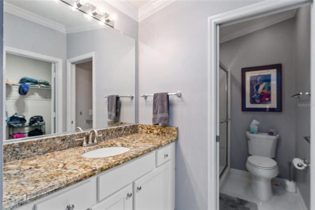 full bath with vanity, a shower stall, toilet, and ornamental molding