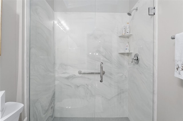 full bath featuring a marble finish shower