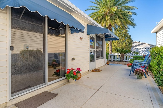 view of patio / terrace featuring fence