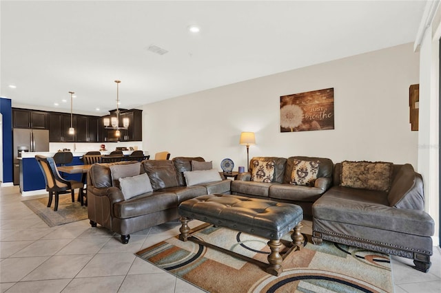 living area with recessed lighting, visible vents, and light tile patterned floors