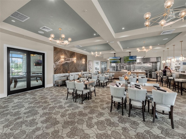 carpeted dining space with a chandelier, coffered ceiling, and visible vents