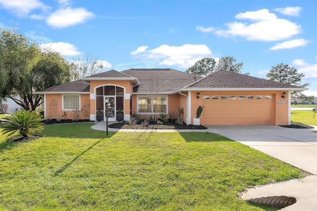 view of front of house with a garage, a front yard, concrete driveway, and stucco siding