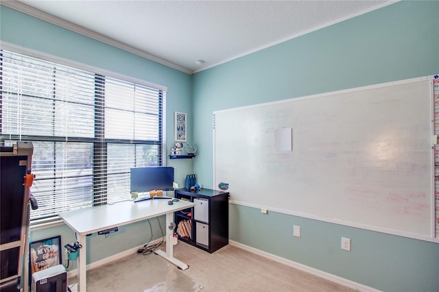 carpeted home office featuring baseboards and ornamental molding