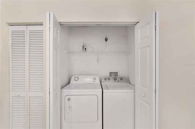 laundry room with laundry area and washer and clothes dryer