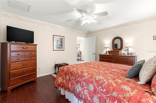 bedroom featuring visible vents, dark wood finished floors, baseboards, and ceiling fan