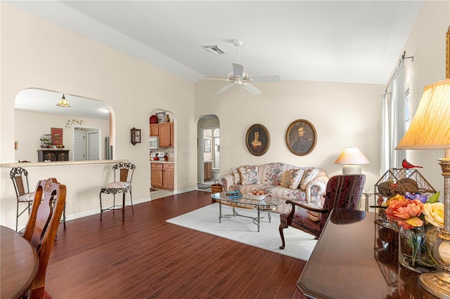 living area with visible vents, arched walkways, lofted ceiling, dark wood-style floors, and ceiling fan