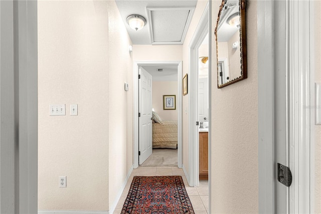 corridor with light tile patterned floors