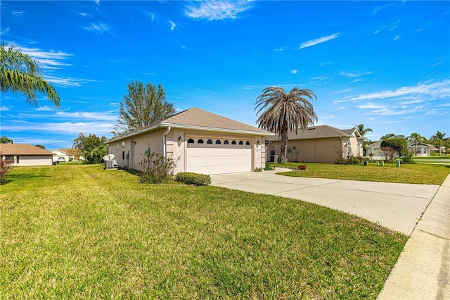 single story home with a garage, driveway, a front lawn, and stucco siding