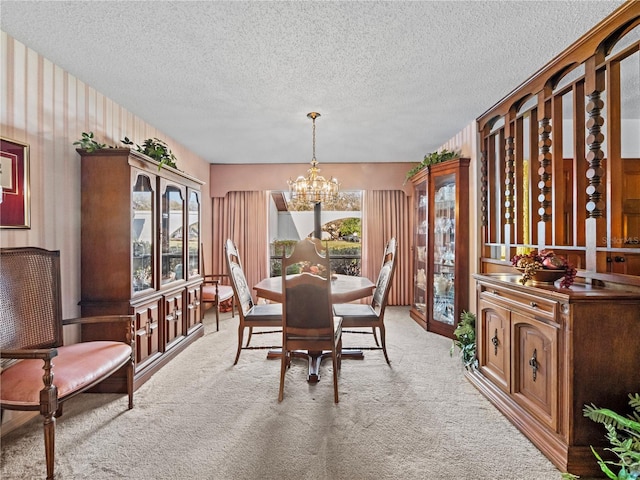 dining area with light carpet, a textured ceiling, and an inviting chandelier