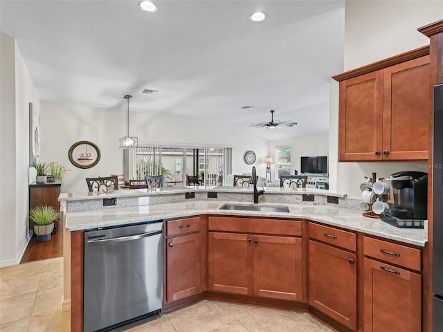 kitchen with lofted ceiling, a sink, a ceiling fan, light stone countertops, and dishwasher