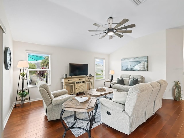 living area featuring dark wood-style flooring, visible vents, baseboards, vaulted ceiling, and a ceiling fan