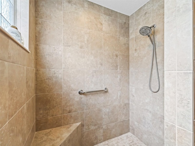 bathroom featuring tiled shower