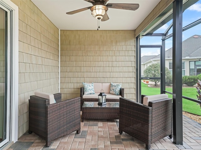 sunroom / solarium with ceiling fan