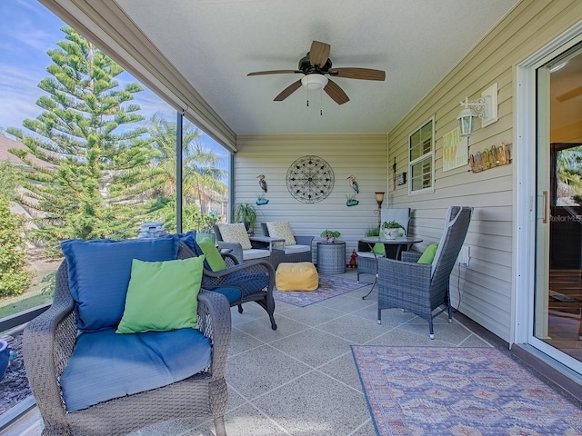 sunroom / solarium with a ceiling fan